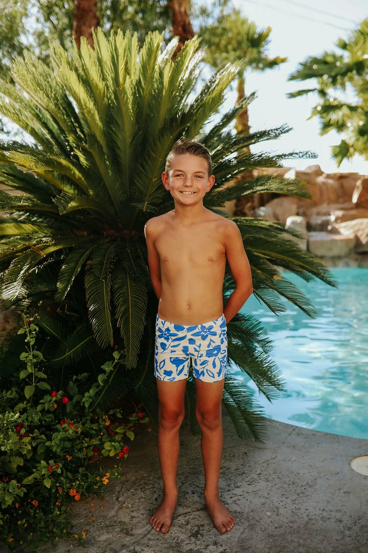 PINK DESERT BOYS EUROPEAN CUT SWIM SHORT IN BLUE FLORAL 5 PINK DESERT BOYS EUROPEAN CUT SWIM SHORT IN BLUE FLORAL
