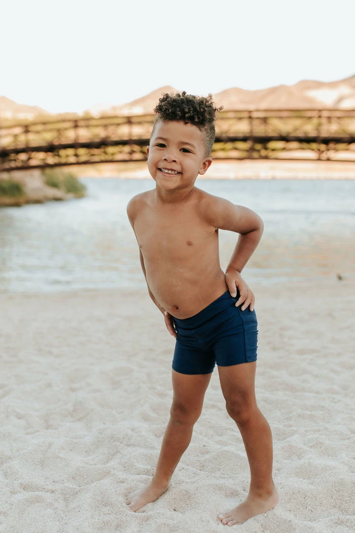 PINK DESERT BOYS EUROPEAN CUT SWIM SHORT IN INDIGO 1 PINK DESERT BOYS EUROPEAN CUT SWIM SHORT IN INDIGO