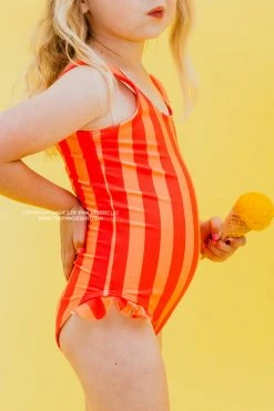 GIRLS MINI RUFFLE LEG SCOOP ONE PIECE SWIMSUIT IN SORBET STRIPE BY PINK DESERT