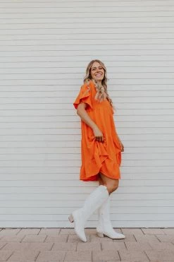 Adora THE OAKLEY TIERED BABYDOLL DRESS IN ORANGE DRESSES