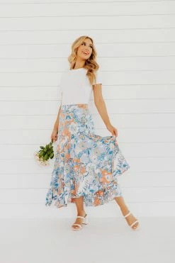 Faith Apparel NEW ARRIVALS THE BOWAN FLORAL MIDI SKIRT IN BLUE