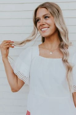 Skies Are Blue TOPS THE CAUGHT MY EYE PEPLUM TOP IN WHITE