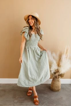 Miou Muse THE SAGE SMOCKED MIDI DRESS IN GREEN