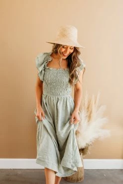 Miou Muse THE SAGE SMOCKED MIDI DRESS IN GREEN