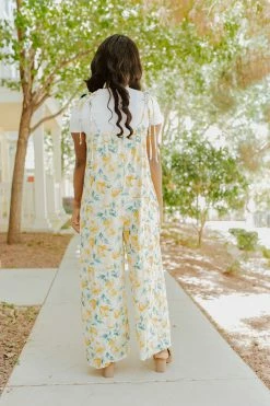 Ces Femme THE TAHITI TIE STRAP JUMPSUIT IN YELLOW FLORAL