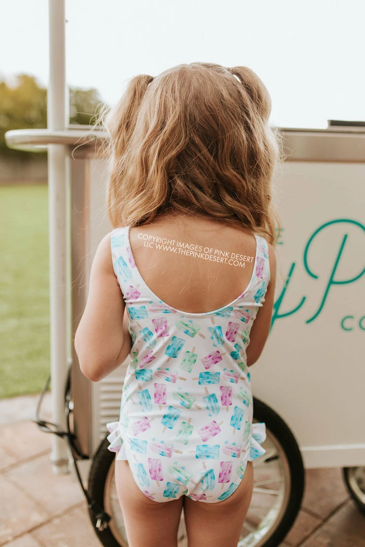 PINK DESERT GIRLS MINI RUFFLE LEG SCOOP ONE PIECE SWIMSUIT IN POPSICLE 2 PINK DESERT GIRLS MINI RUFFLE LEG SCOOP ONE PIECE SWIMSUIT IN POPSICLE