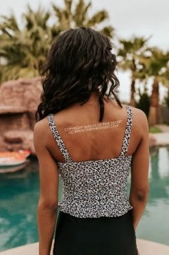 PINK DESERT MINI RUFFLE CROP PEPLUM SWIM TOP IN SNOW LEOPARD