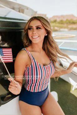 PINK DESERT BUTTON FRONT MIDKINI SWIM TOP IN AMERICANA STRIPE