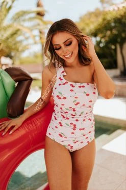 PINK DESERT RUCHED ONE SHOULDER ONE PIECE SWIMSUIT IN CHERRY BOMB