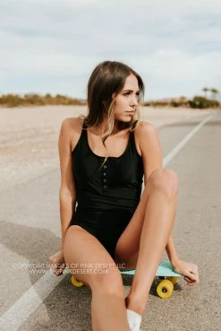 PINK DESERT BUTTON FRONT ONE PIECE IN BLACK