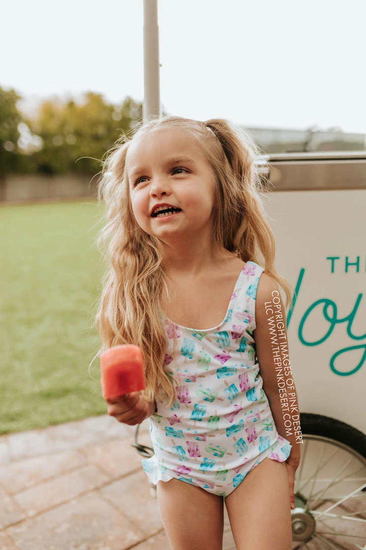 PINK DESERT GIRLS MINI RUFFLE LEG SCOOP ONE PIECE SWIMSUIT IN POPSICLE 1 PINK DESERT GIRLS MINI RUFFLE LEG SCOOP ONE PIECE SWIMSUIT IN POPSICLE