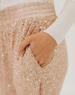 Aaron & Amber THE SHINE BRIGHT SEQUIN JOGGERS IN ROSE CHAMPAGNE BOTTOMS