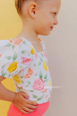 GIRLS PUFF SLEEVE SWIM TOP IN CITRUS PRINT BY SASSY RED LIPSTICK X PINK DESERT