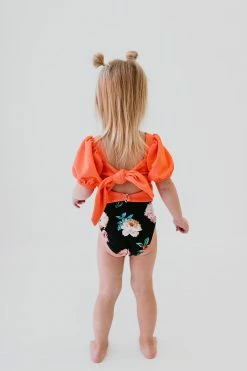 GIRLS PUFF SLEEVE SWIM TOP IN RIBBED PEACHBERRY BY PINK DESERT