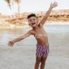 PINK DESERT BOYS EUROPEAN CUT SWIM SHORT IN AMERICANA STRIPE