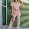 Skies Are Blue THE PALMER TIE WAIST JUMPSUIT IN PEACH TOPS