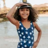 PINK DESERT GIRLS MINI RUFFLE LEG SCOOP ONE PIECE SWIMSUIT IN SPANGLED STAR PRINT