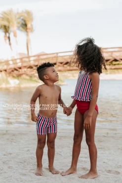 PINK DESERT GIRLS MINI RUFFLE PEPLUM SWIMSUIT SET IN AMERICANA STRIPE AND CHERRY RED