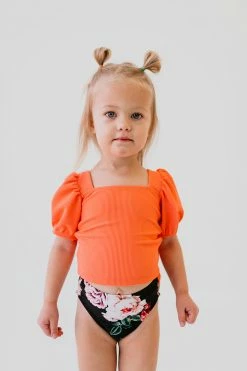 GIRLS PUFF SLEEVE SWIM TOP IN RIBBED PEACHBERRY BY PINK DESERT
