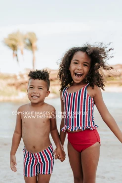 PINK DESERT GIRLS MINI RUFFLE PEPLUM SWIMSUIT SET IN AMERICANA STRIPE AND CHERRY RED