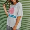 Style U THE AMERICA SMILEY GRAPHIC TEE IN SAND TOPS