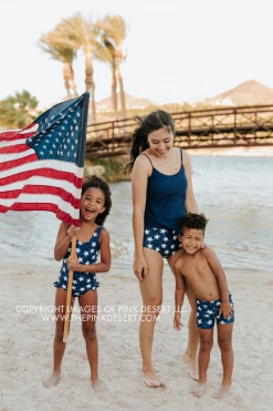 PINK DESERT BOYS EUROPEAN CUT SWIM SHORT IN SPANGLED STAR PRINT