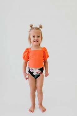 GIRLS PUFF SLEEVE SWIM TOP IN RIBBED PEACHBERRY BY PINK DESERT